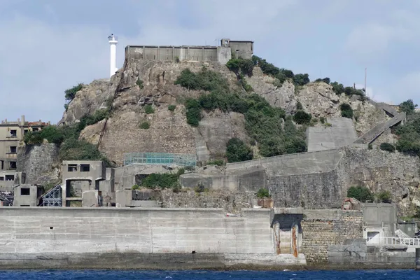 View of hill with retaining wall and lighthouse