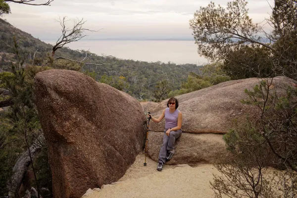 Chris, sitting on rock